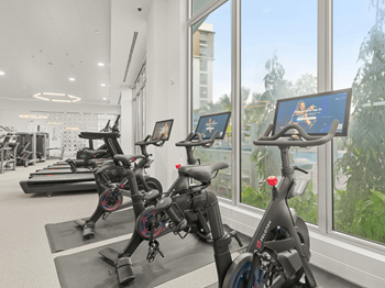 24-Hour professional fitness center featuring peloton® bikes